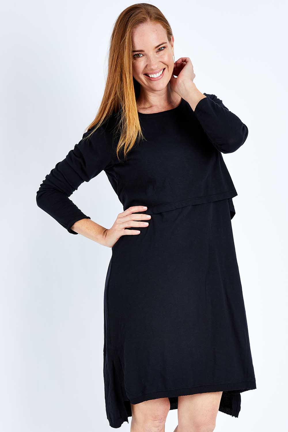 Model Katie wearing size 10 of the Elements Highline Long Sleeve Dress in colour Black (Black), from the front, cropped image