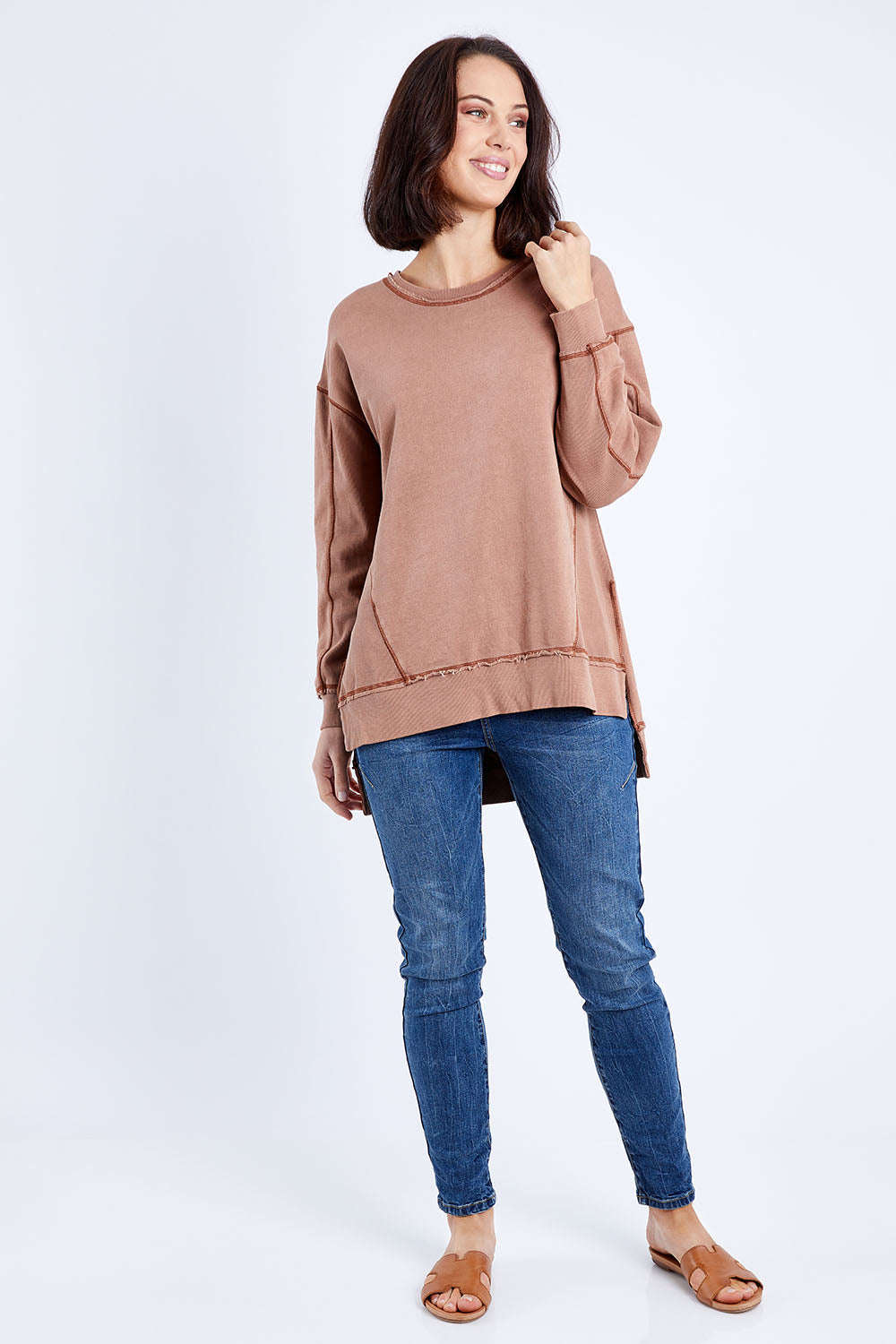 Model Andrea wearing size 10 of the Elements Fleur Crew in colour Rustbronze, from the front, showing the whole outfit