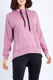 Model Andrea wearing size 10 of the Elements Jasmine Hoodie in colour Rosepink (Pink), from the front, cropped image