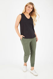 Model Hayley wearing size 10 of the Chelsea Pant in colour Khaki (Green), from the front, showing the whole outfit