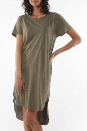 A model wearing the Elements Bayley Dress in colour Khaki (Green), from the front, cropped image