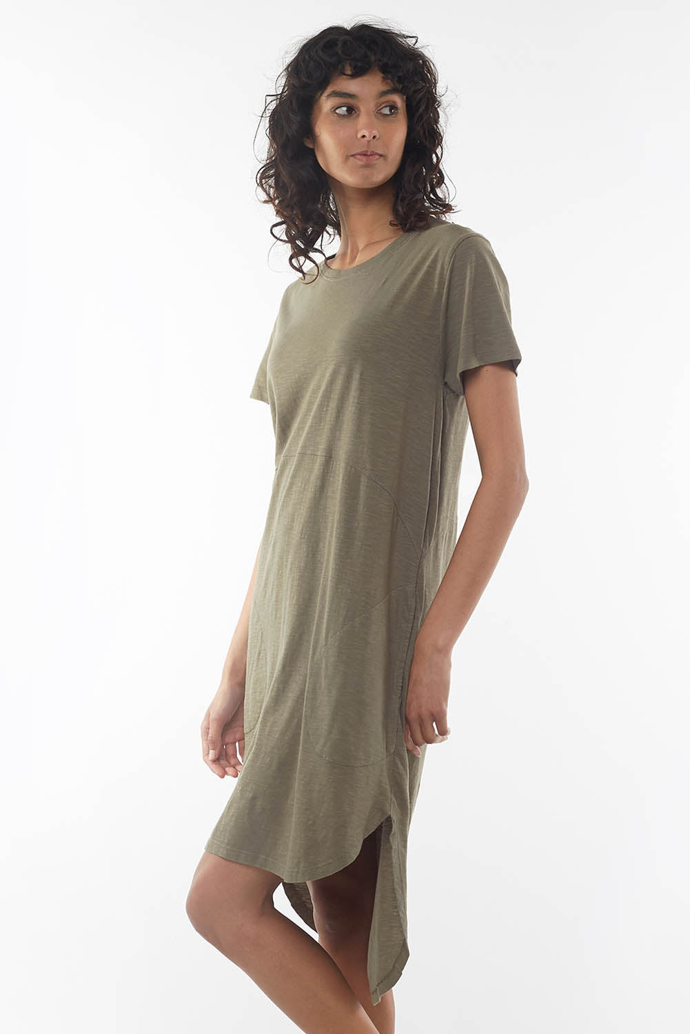 A model wearing the Elements Bayley Dress in colour Khaki (Green), from the front, cropped image