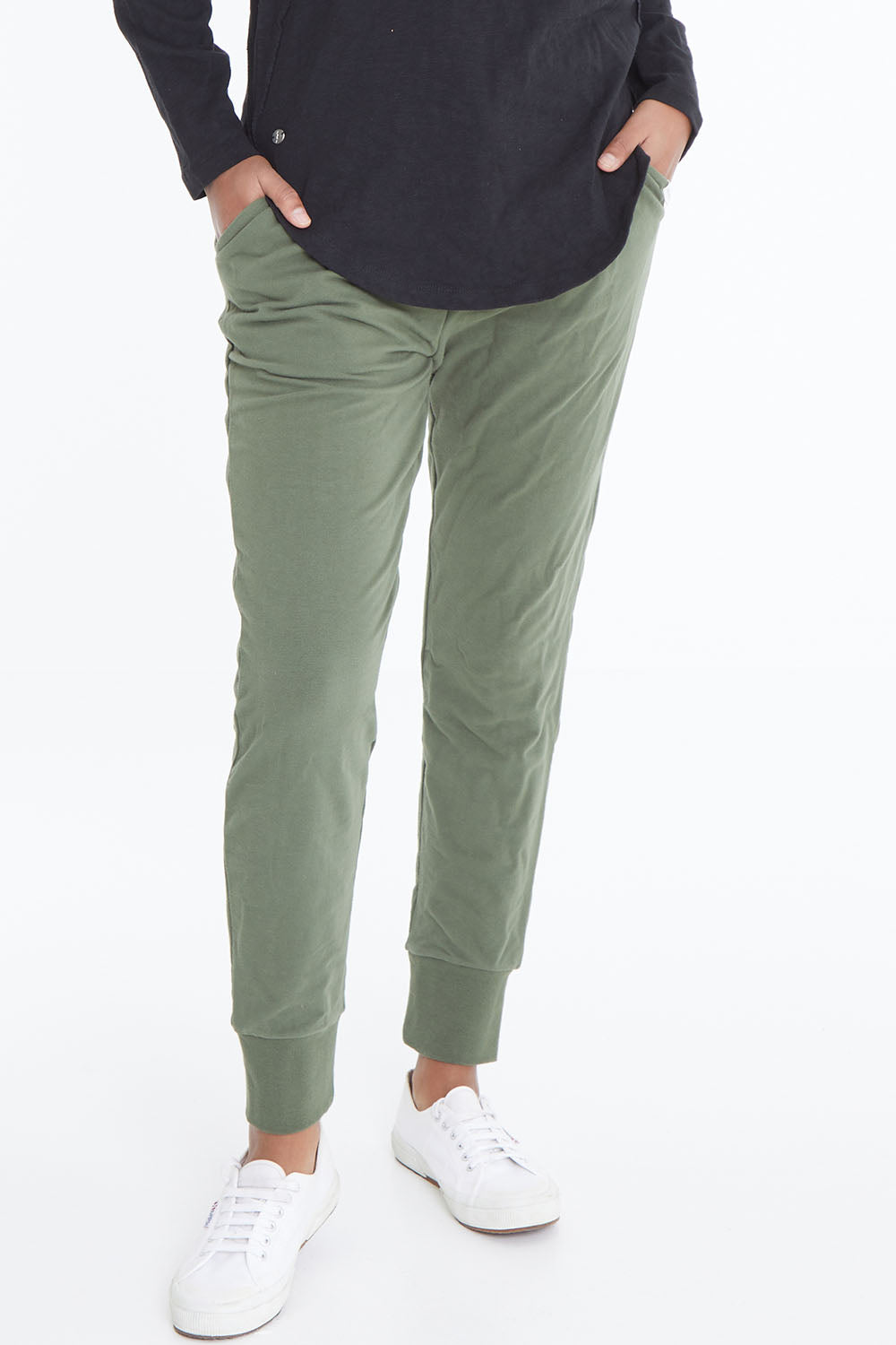 Model Schanez wearing size 10 of the Elements Lazy Days Pant in colour Khaki (Green), from the front, cropped image