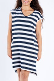 Model Larissa wearing size 10 of the Elements Rainbow Beach Dress in colour Navywhite (White), from the front, cropped image