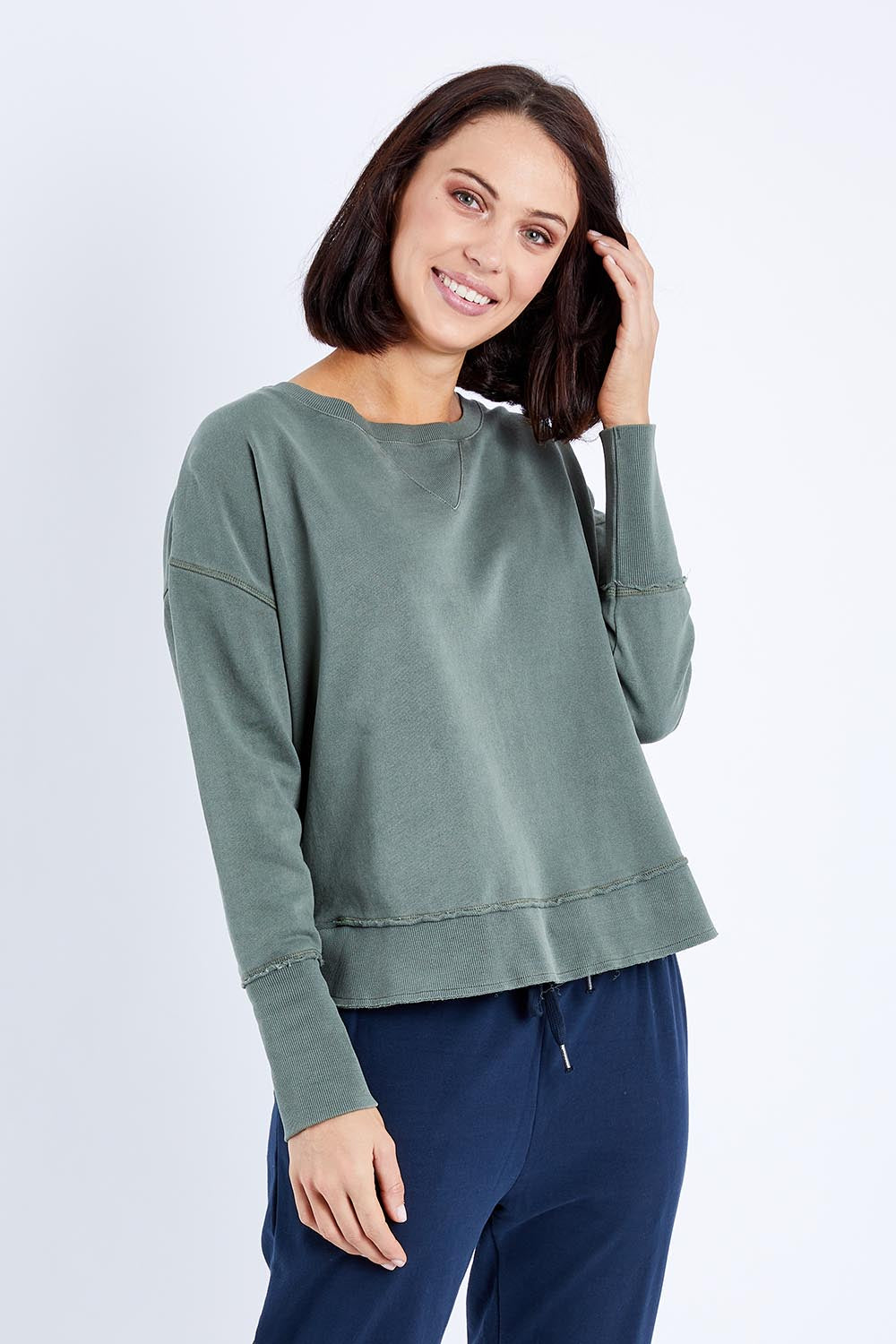 Model Andrea wearing size 10 of the Elements Delilah Crew in colour Khaki (Green), from the front, cropped image