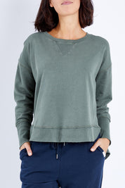Model Andrea wearing size 10 of the Elements Delilah Crew in colour Khaki (Green), from the front, cropped image