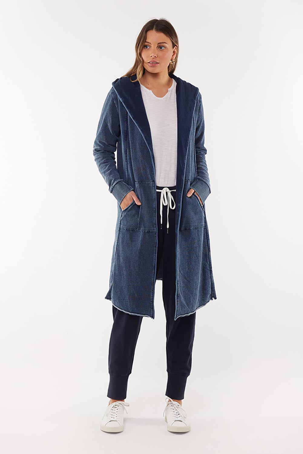 A model wearing the Elements Annie Hooded Cardigan in colour Washedenim (Blue), from the front, showing the whole outfit