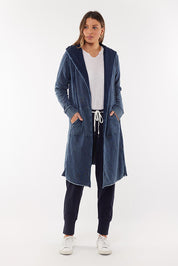 A model wearing the Elements Annie Hooded Cardigan in colour Washedenim (Blue), from the front, showing the whole outfit