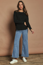 Model Madeline wearing size 10 of the Elements Simplified Cotton Crew in colour Black (Black), from the front, showing the whole outfit