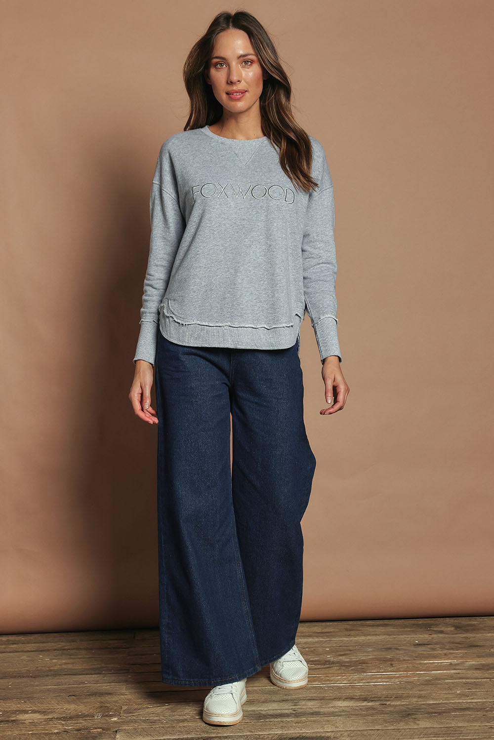 Model Madeline wearing size 10 of the Elements Simplified Cotton Crew in colour Greymarle (Grey), from the front, showing the whole outfit