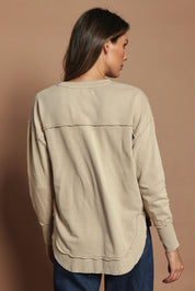 Model Madeline wearing size 10 of the Elements Simplified Cotton Crew in colour Oat, from the back