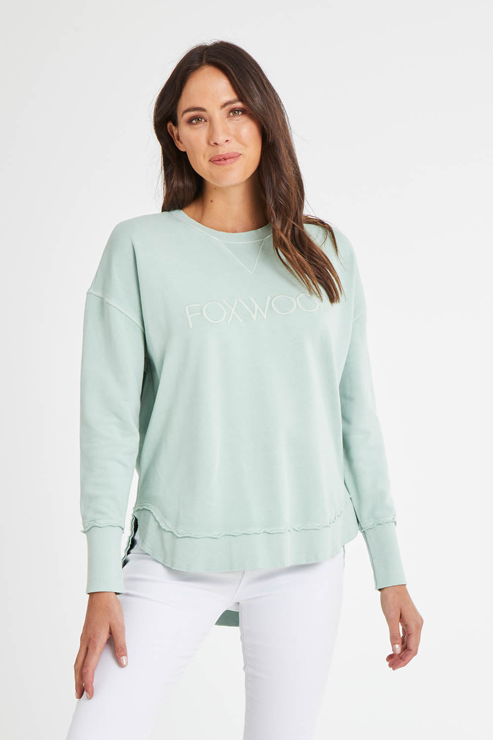 Model Madeline wearing size 10 of the Elements Simplified Cotton Crew in colour Seafoam (Green), from the front, cropped image