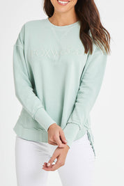Model Madeline wearing size 10 of the Elements Simplified Cotton Crew in colour Seafoam (Green), from the front, cropped image