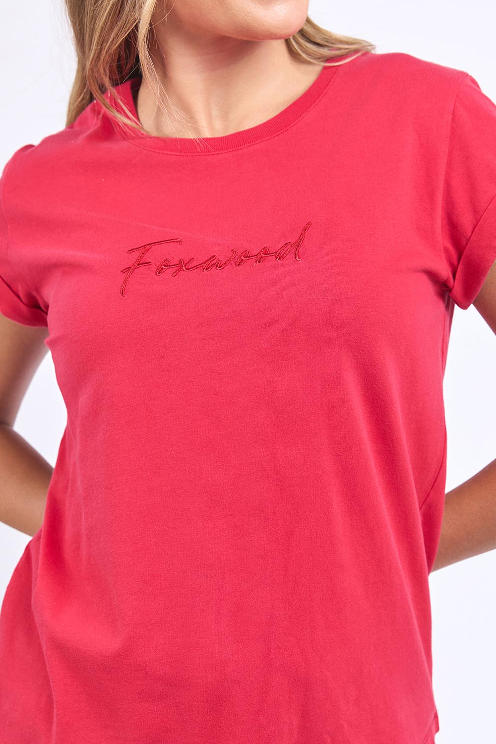 A model wearing the Elements Signature Cotton Tee in colour Crimson (Red), from the front, cropped image