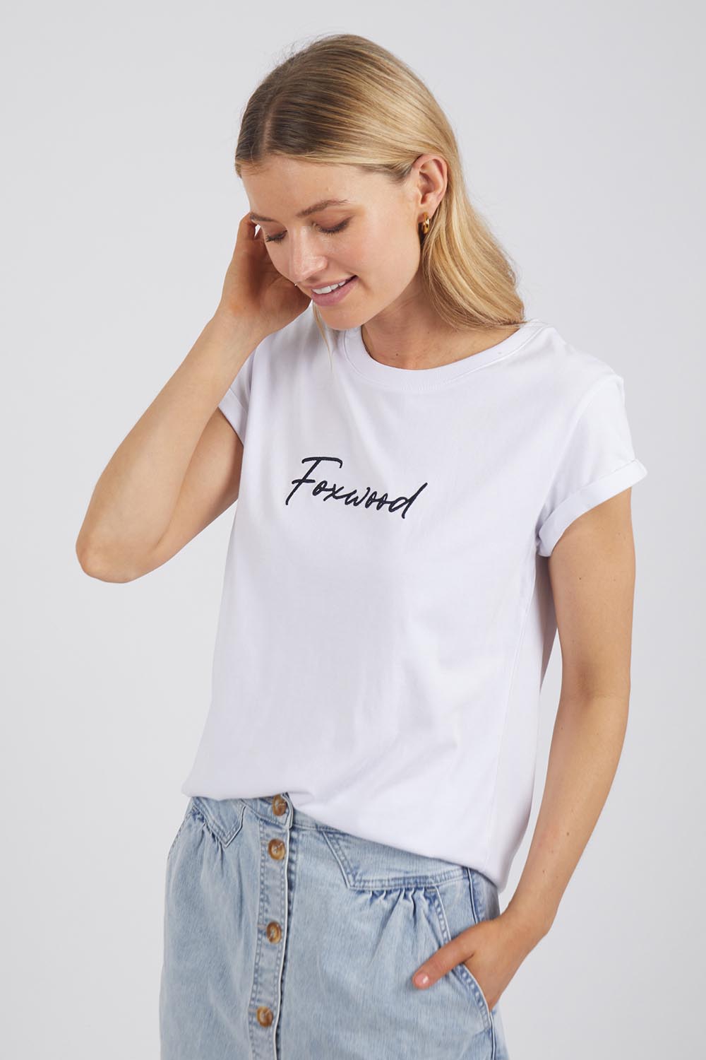 A model wearing the Elements Signature Cotton Tee in colour White (White), from the front, cropped image