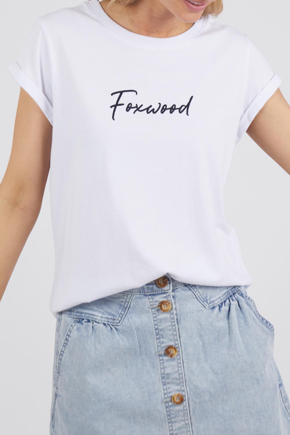 A model wearing the Elements Signature Cotton Tee in colour White (White), from the front, cropped image