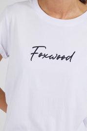 A model wearing the Elements Signature Cotton Tee in colour White (White), from the front, cropped image
