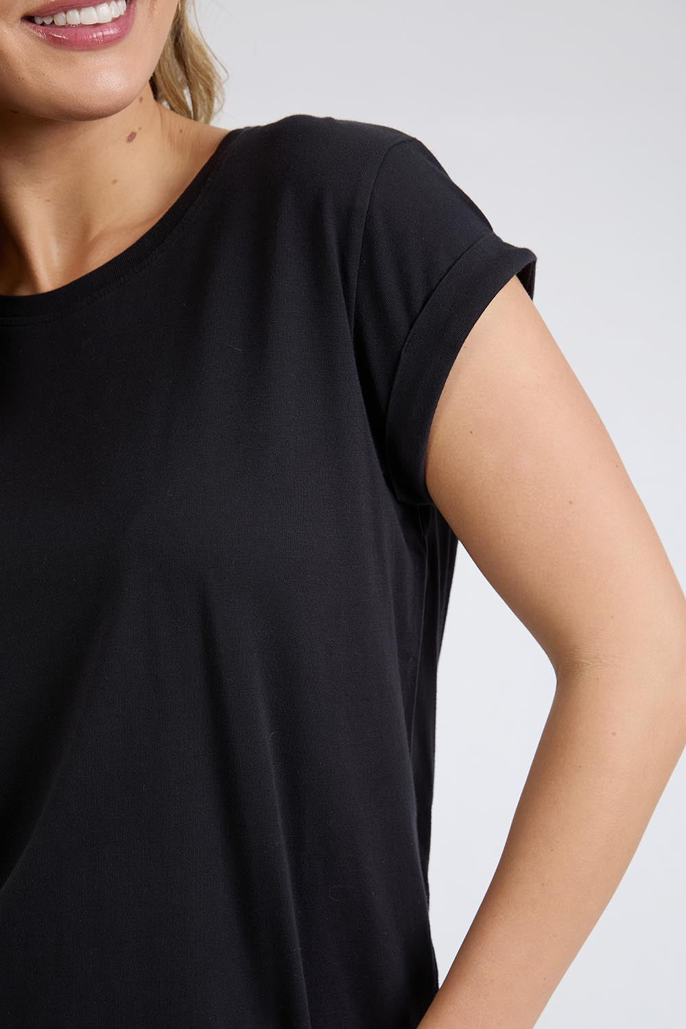 A model wearing the Elements Manly Cotton Tee in colour Black (Black), from the front, cropped image