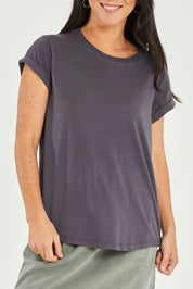 Model Katie wearing size 10 of the Elements Manly Cotton Tee in colour Coal (Black), from the front, cropped image