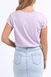 A model wearing the Elements Manly Cotton Tee in colour Orchidbloo (Purple), from the back