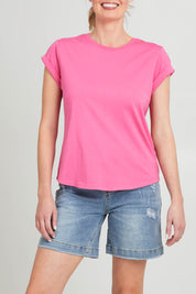 Model Grace wearing size 10 of the Elements Manly Cotton Tee in colour Pinkpunch (Pink), from the front, cropped image