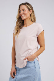 A model wearing the Elements Manly Cotton Tee in colour Pnklotus (Pink), from the front, cropped image