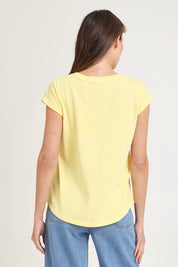 Model Madeline wearing size 10 of the Elements Manly Cotton Tee in colour Sunshine, from the back