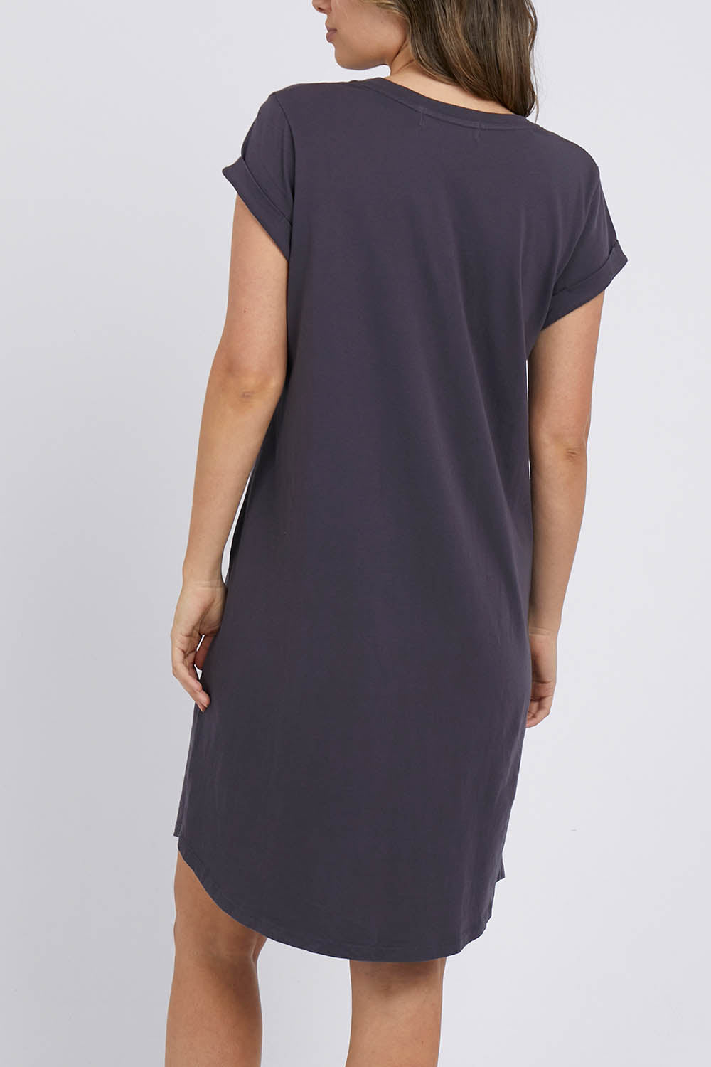 A model wearing the Elements Manly Tee Dress in colour Coal (Grey), from the back