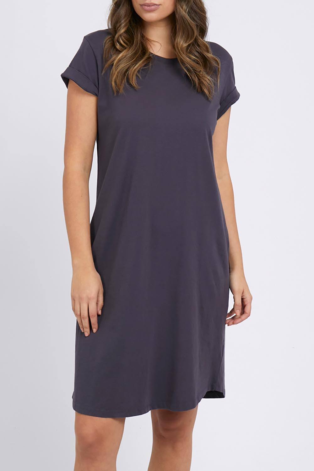 A model wearing the Elements Manly Tee Dress in colour Coal (Grey), from the front, cropped image