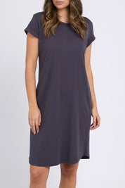 A model wearing the Elements Manly Tee Dress in colour Coal (Grey), from the front, cropped image