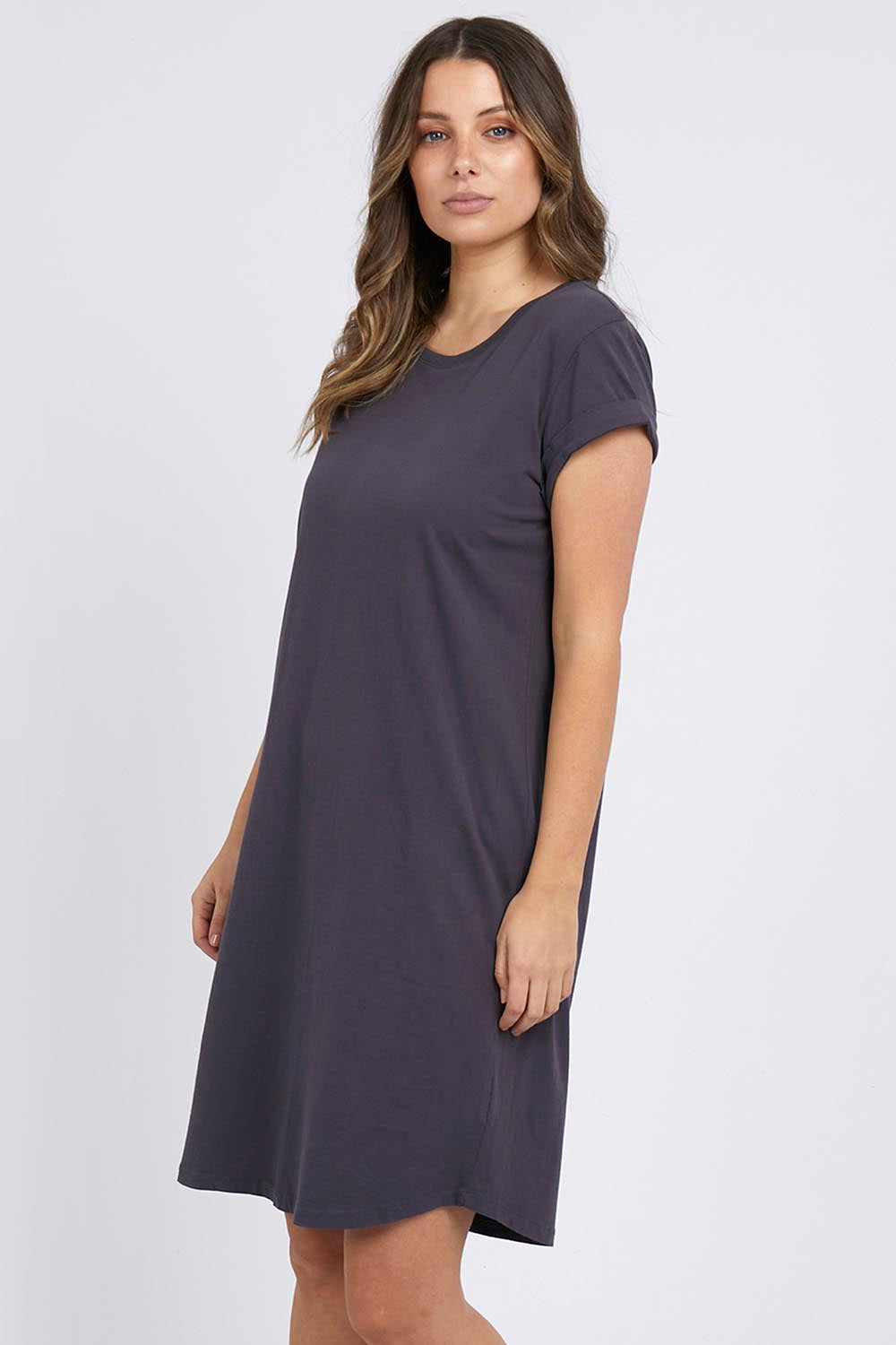 A model wearing the Elements Manly Tee Dress in colour Coal (Grey), from the front, cropped image