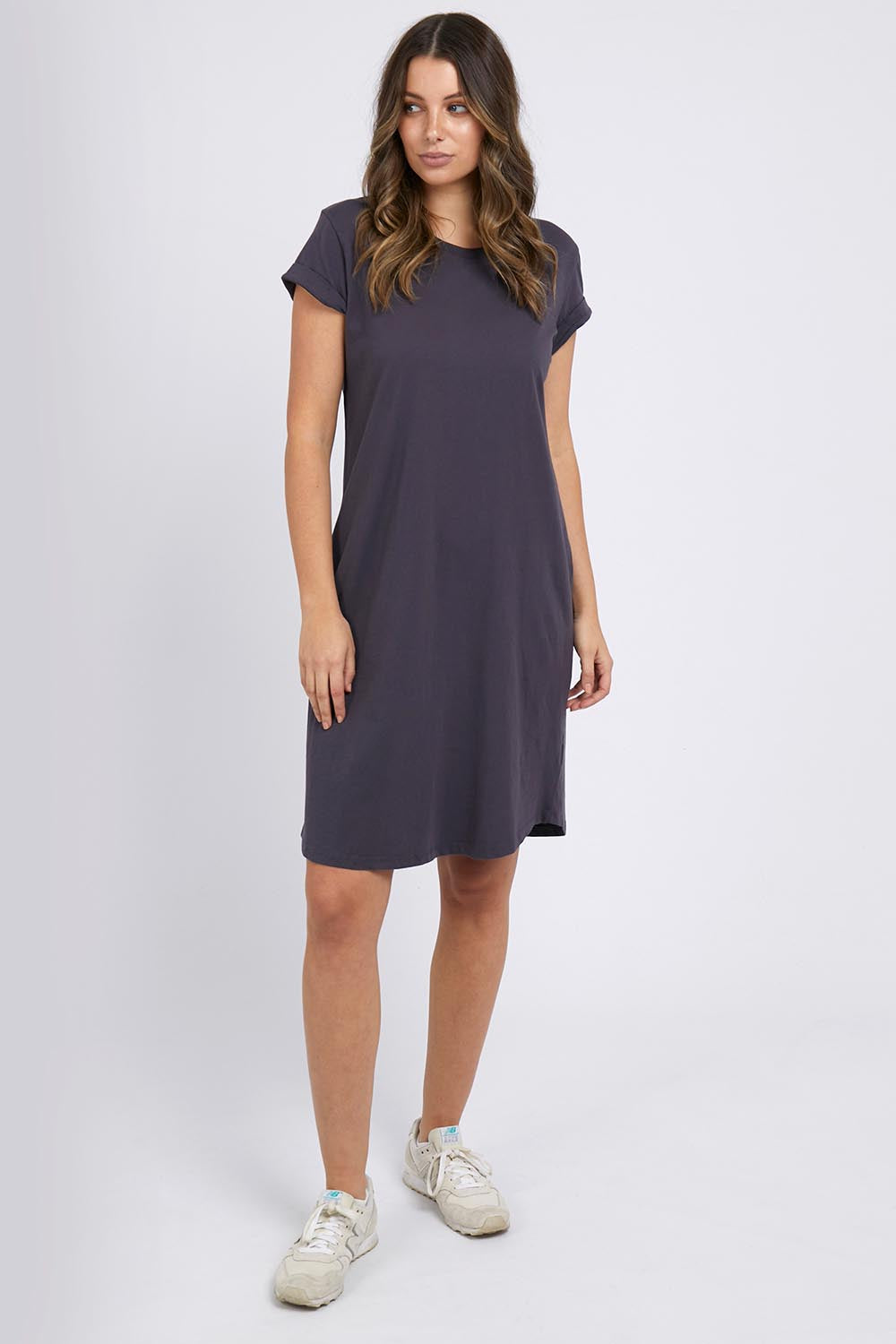 A model wearing the Elements Manly Tee Dress in colour Coal (Grey), from the front, showing the whole outfit