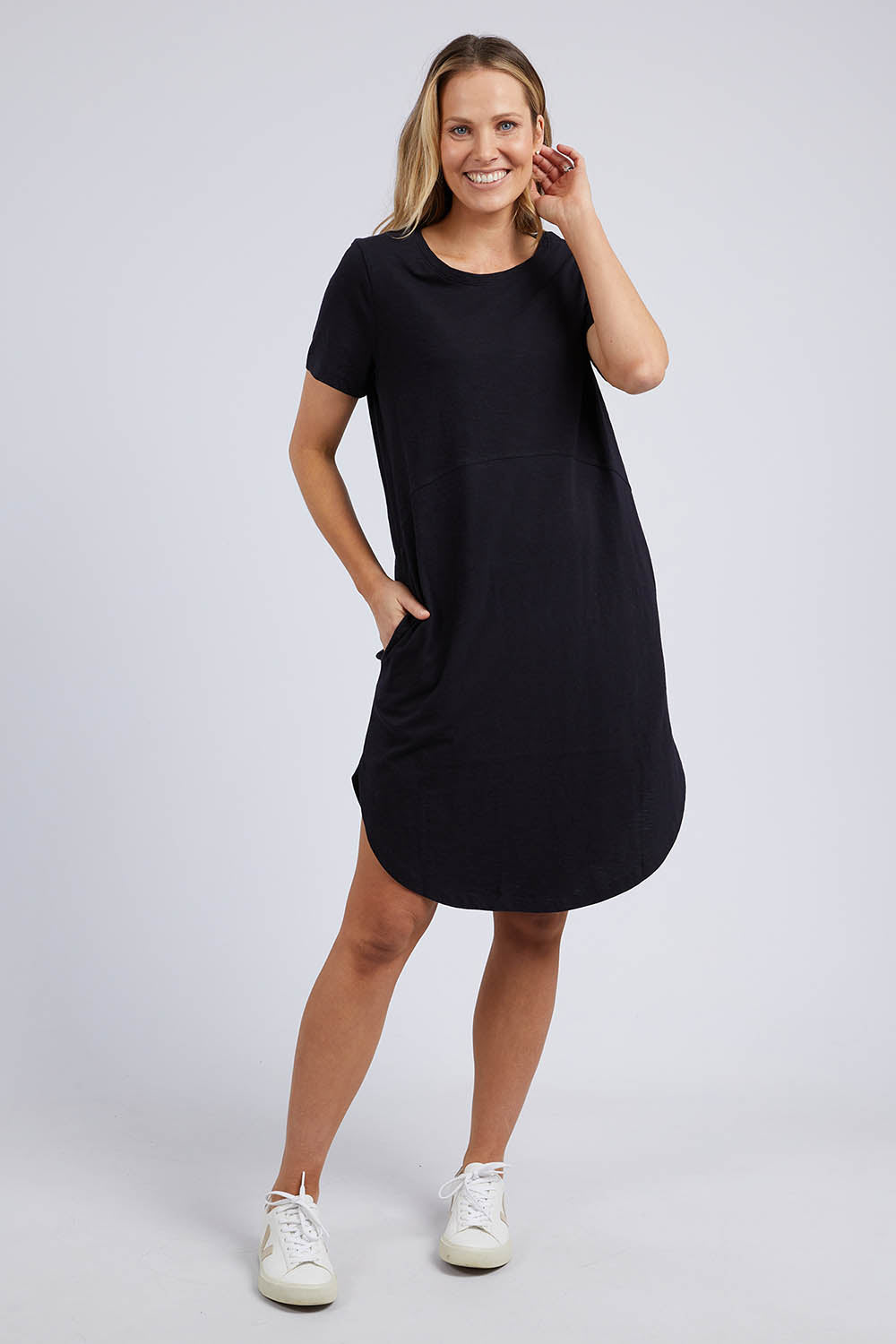 A model wearing the Elements Bay Cotton Dress in colour Black (Black), from the front, showing the whole outfit