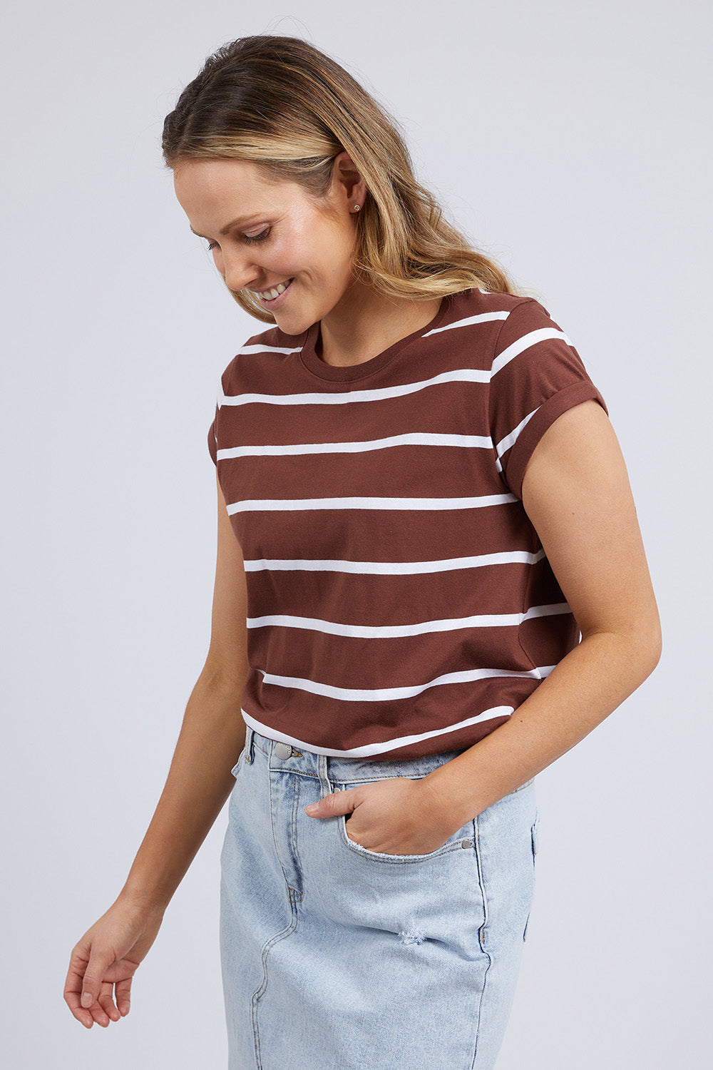 A model wearing the Elements Manly Stripe Cotton Tee in colour Chocstripe, from the front, cropped image