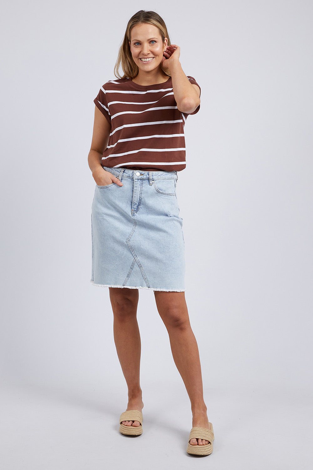 A model wearing the Elements Manly Stripe Cotton Tee in colour Chocstripe, from the front, showing the whole outfit