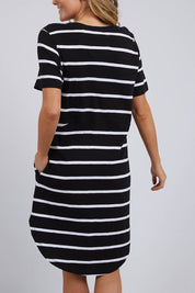 A model wearing the Elements Bay Stripe Dress in colour Blackwhite (Black), from the back