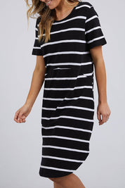 A model wearing the Elements Bay Stripe Dress in colour Blackwhite (Black), from the front, cropped image