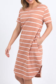 A model wearing the Elements Bay Stripe Dress in colour Claywhite, from the front, cropped image