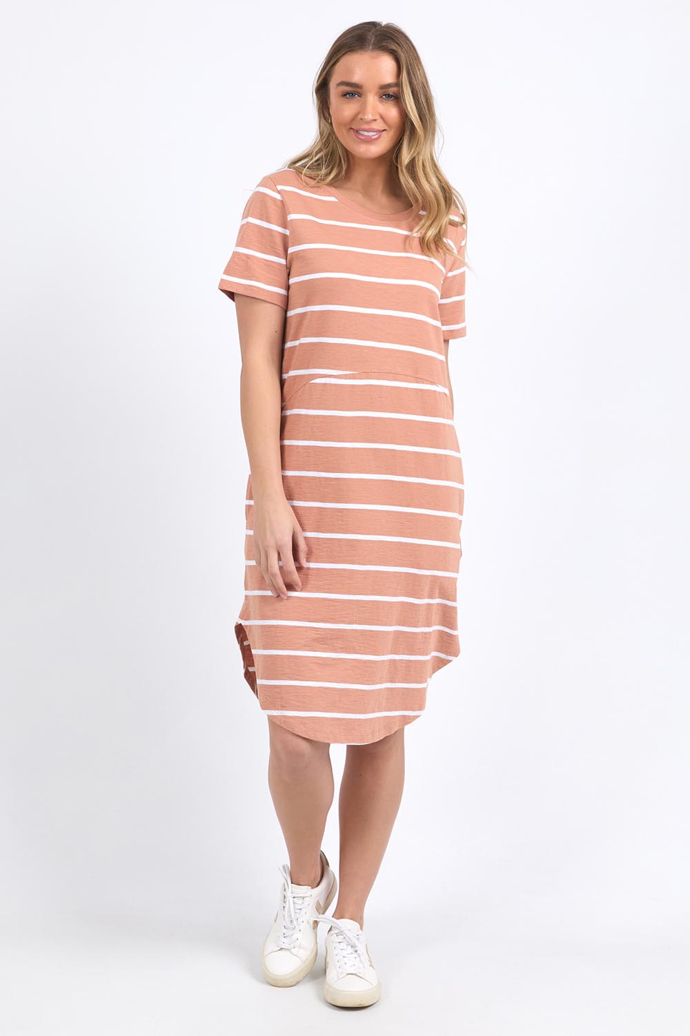 A model wearing the Elements Bay Stripe Dress in colour Claywhite, from the front, showing the whole outfit