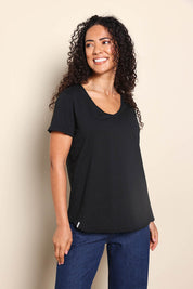 Model Pamelar wearing size 10 of the Elements Manly Cotton Vee Tee - Black in colour Black, from an angle