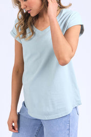 A model wearing the Elements Manly Cotton Vee Tee in colour Bluebelle (Blue), from the front, cropped image