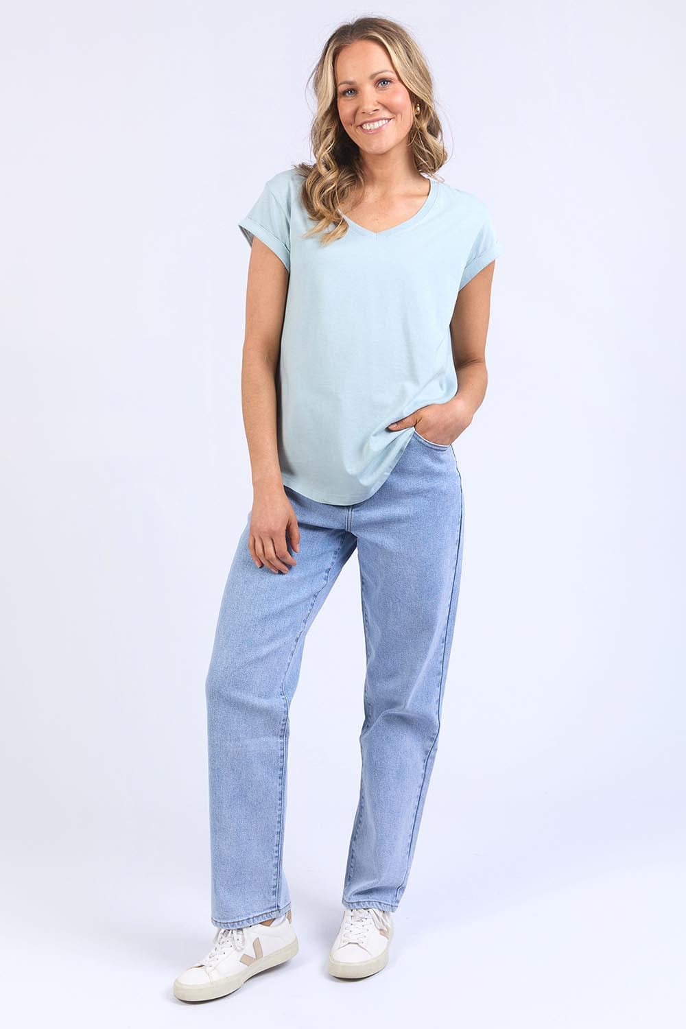 A model wearing the Elements Manly Cotton Vee Tee in colour Bluebelle (Blue), from the front, showing the whole outfit