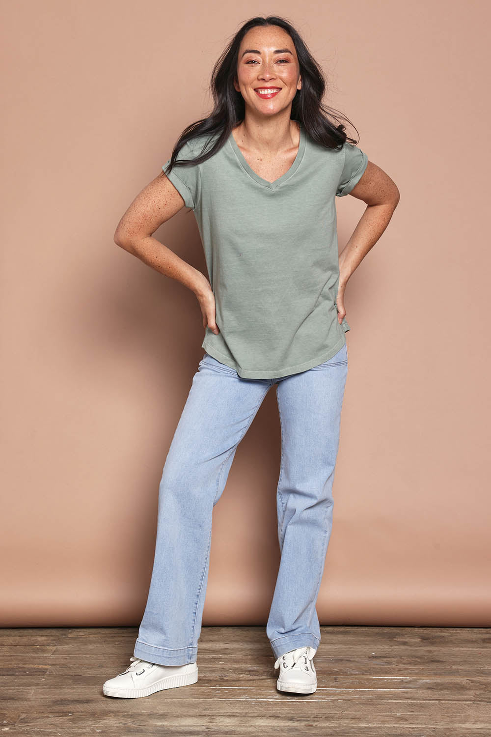 Model Katie wearing size 8 of the Elements Manly Cotton Vee Tee in colour Iceberggre (Green), from the front, showing the whole outfit
