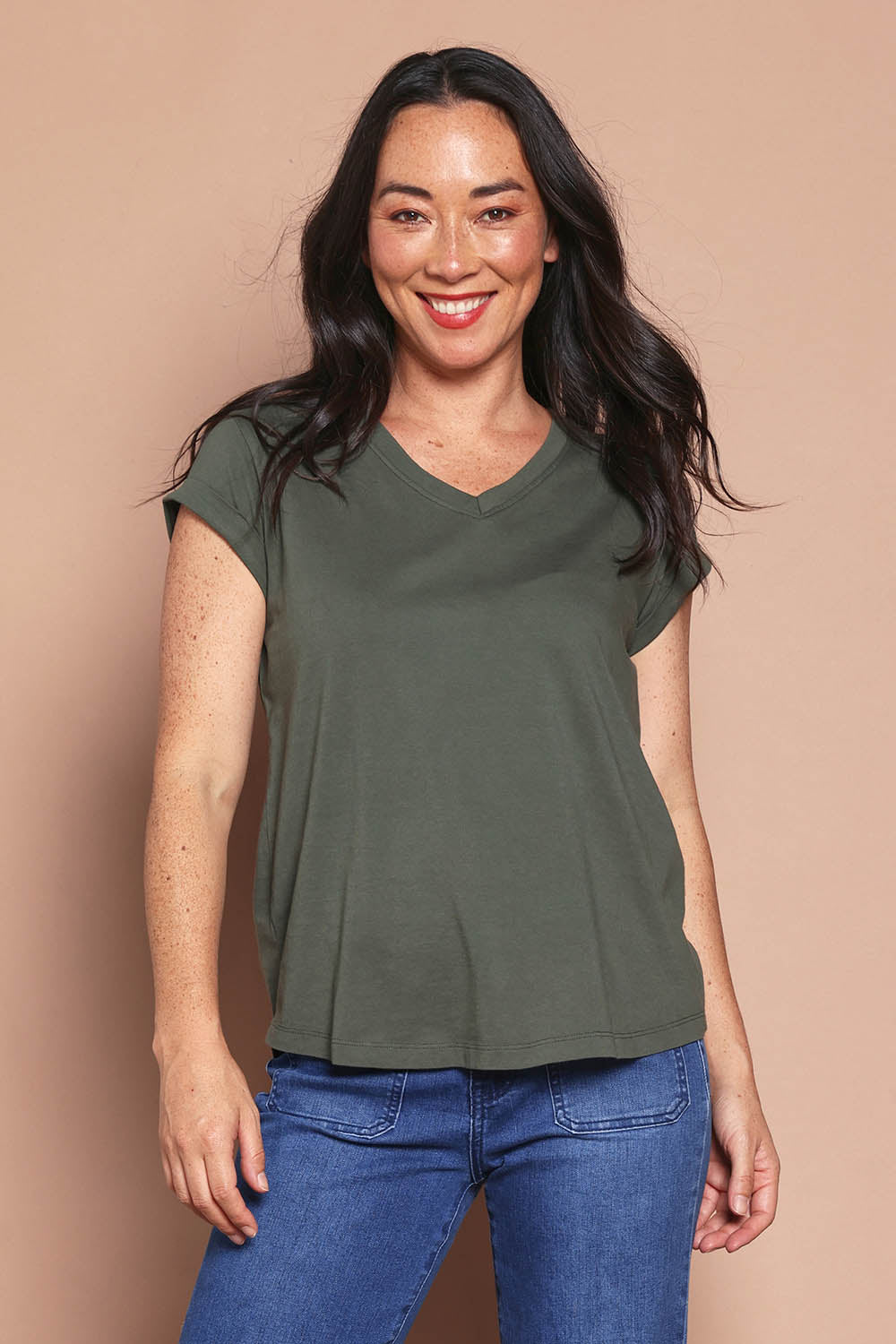Model Katie wearing size 8 of the Elements Manly Cotton Vee Tee in colour Khaki (Green), from the front, cropped image