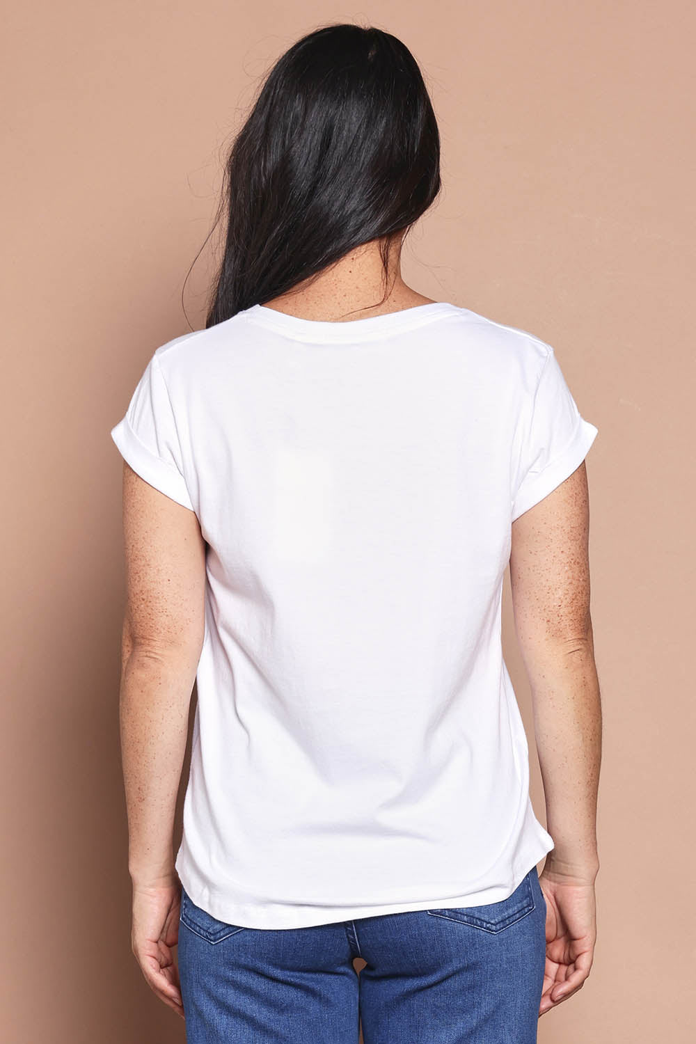 Model Katie wearing size 8 of the Elements Manly Cotton Vee Tee in colour White (White), from the back