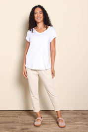 Model Pamelar wearing size 10 of the Elements Manly Cotton Vee Tee - White in colour White, from the front