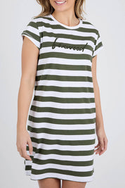 A model wearing the Elements Signature Tee Dress in colour Khakiwhite (Green), from the front, cropped image