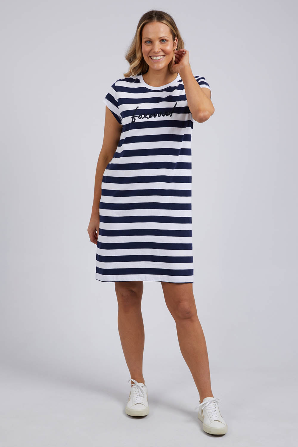 A model wearing the Elements Signature Tee Dress in colour Sapstripe (Blue), from the front, showing the whole outfit