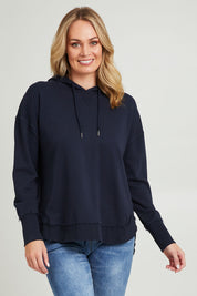 Model Grace wearing size 10 of the Elements Sigrid Hoody in colour Dksapphire (Blue), from the front, cropped image