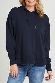 Model Grace wearing size 10 of the Elements Sigrid Hoody in colour Dksapphire (Blue), from the front, cropped image